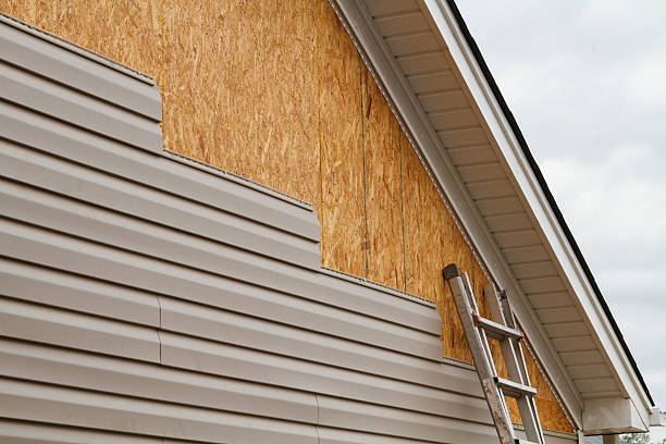 Professional Siding technician working in Oak Park, IL